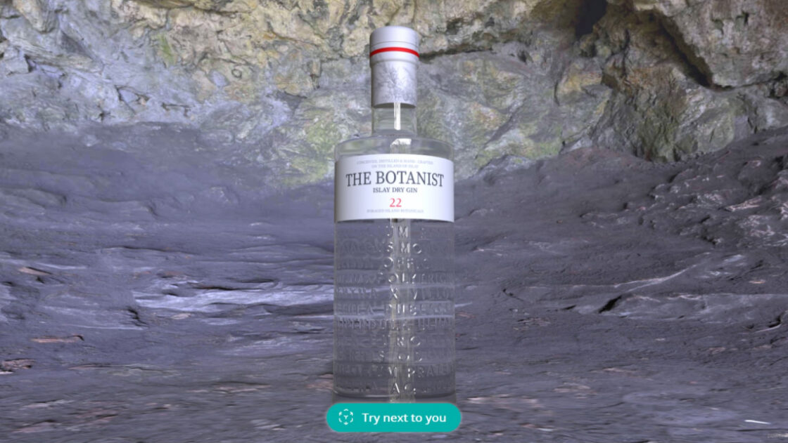 3D model of a Botanist gin bottle showcased on a rock cave background to demonstrate Emersya's transparency technology. The product experience also offers the possibility to vizualise the product in augmented reality in the customer's environment.