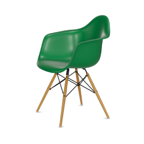 Picture of an Eames DAW plastic chair ash wood base. The color of the plastic chair seat is green.