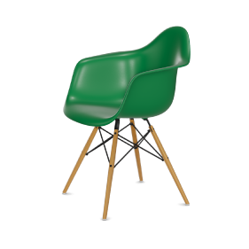 Picture of an Eames DAW plastic chair ash wood base. The color of the plastic chair seat is green.